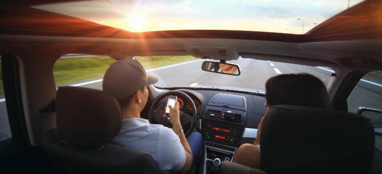 a couple driving to Southwick during a sunset commute