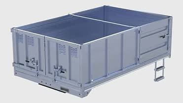 Gray metal railway gondola car with two compartments and a side ladder.