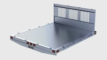 Flatbed truck bed, diamond plate floor, with headboard and lights.