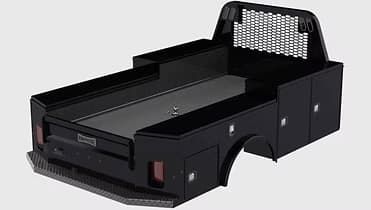 Black truck bed with storage compartments, a headache rack, and a gooseneck hitch.