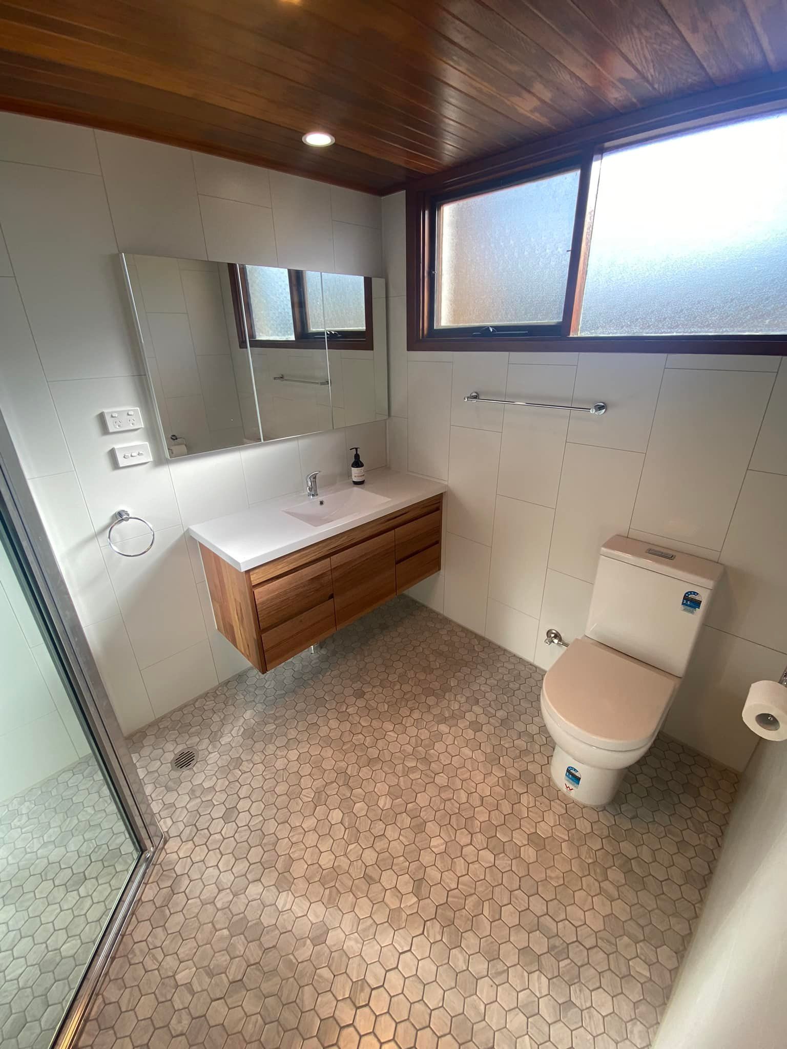 A Wooden Deck with A View of A Lake — P & M Maintenance Building Services in Yass River, NSW