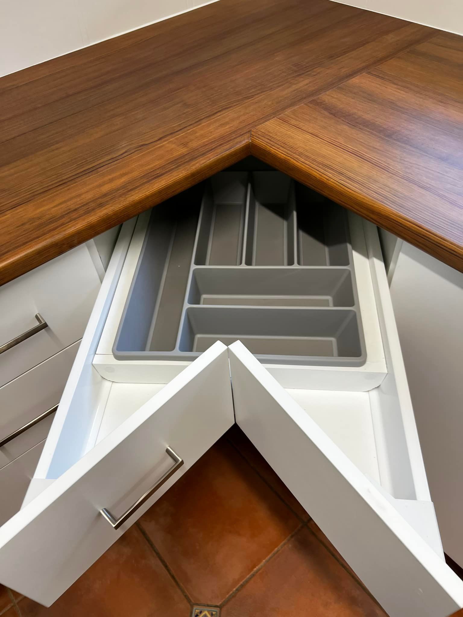 A Wooden Deck with A Metal Railing and Stairs Leading up To It — P & M Maintenance Building Services in Yass River, NSW