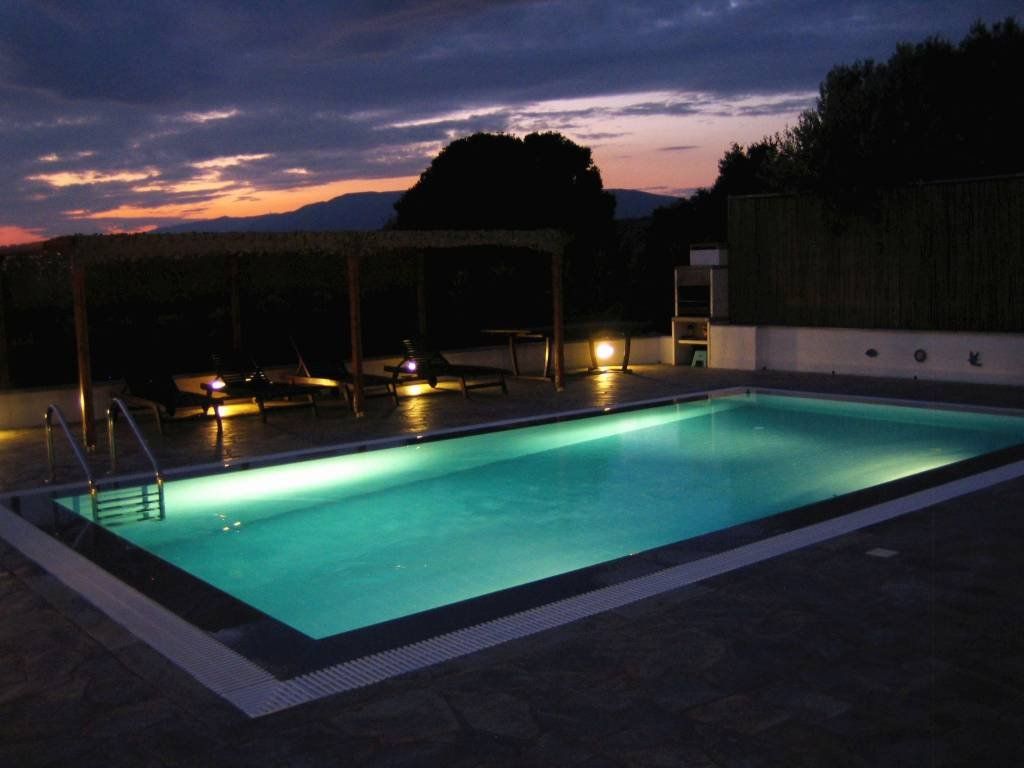 View of swimming pool at night