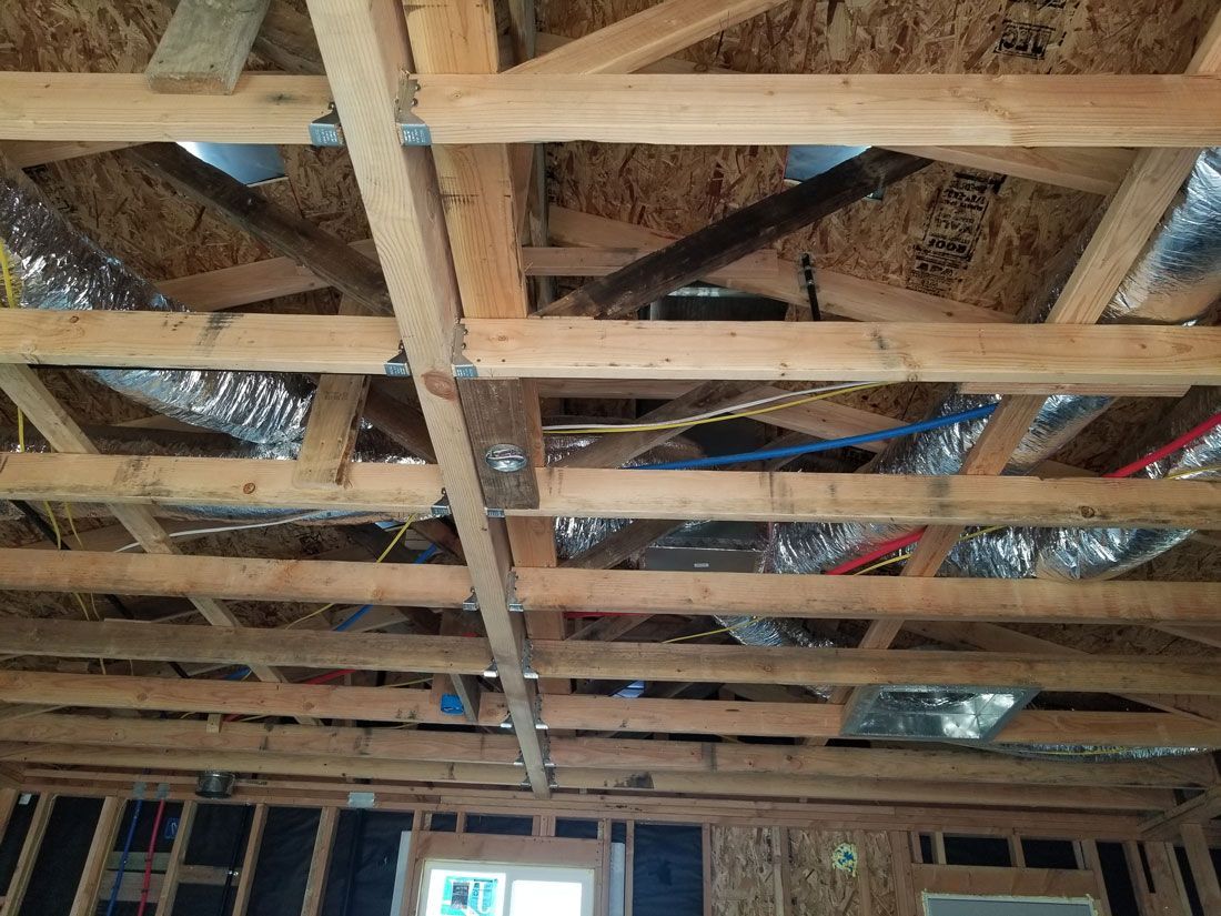 A picture of the ceiling of a house under construction.