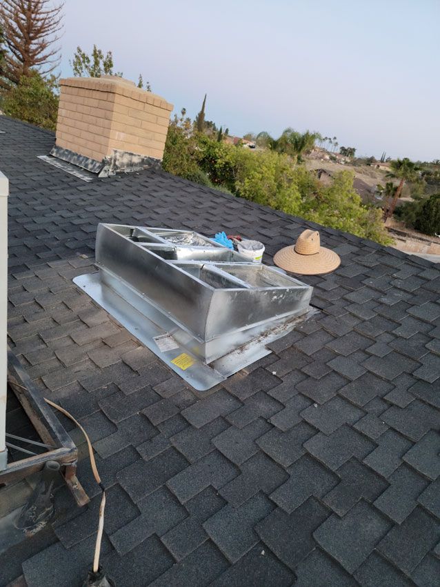 A roof with a chimney and a hat on it