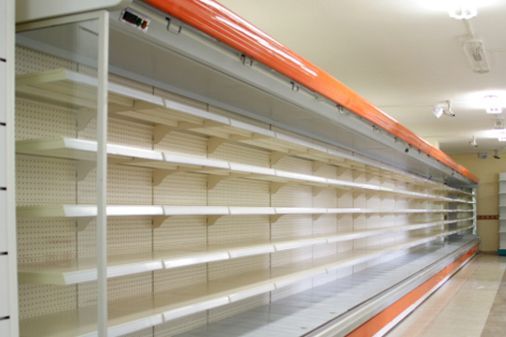 A long row of empty shelves in a store