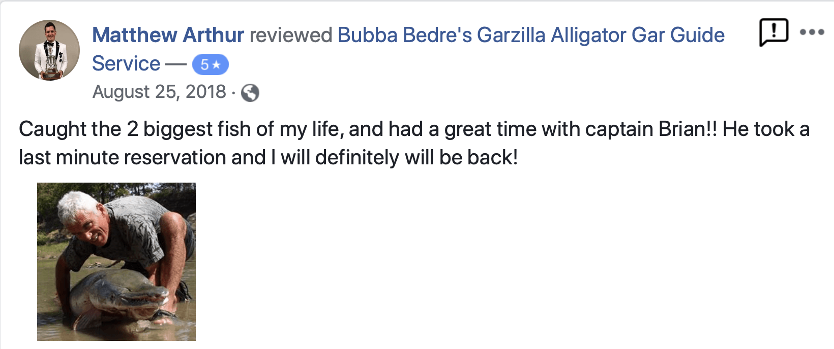 Man holding a large fish. He's smiling. Text says he caught two biggest fish of his life.