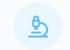 Light blue microscope icon inside a pale blue circle