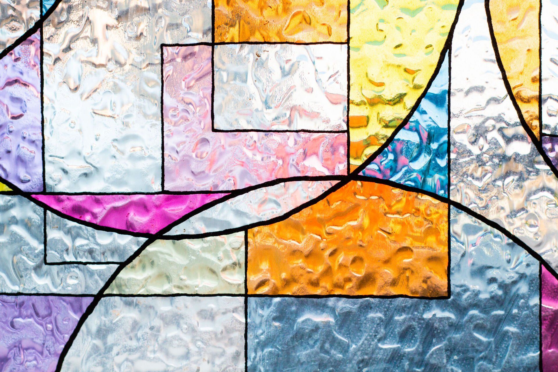 A close up of a colorful stained glass window.