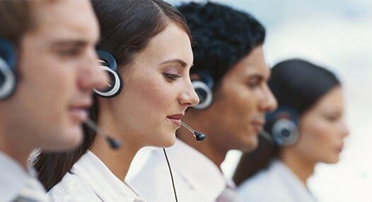 Young Men and Women Working in Call Center — Sales, Service, & Installations in Brooklyn, NY