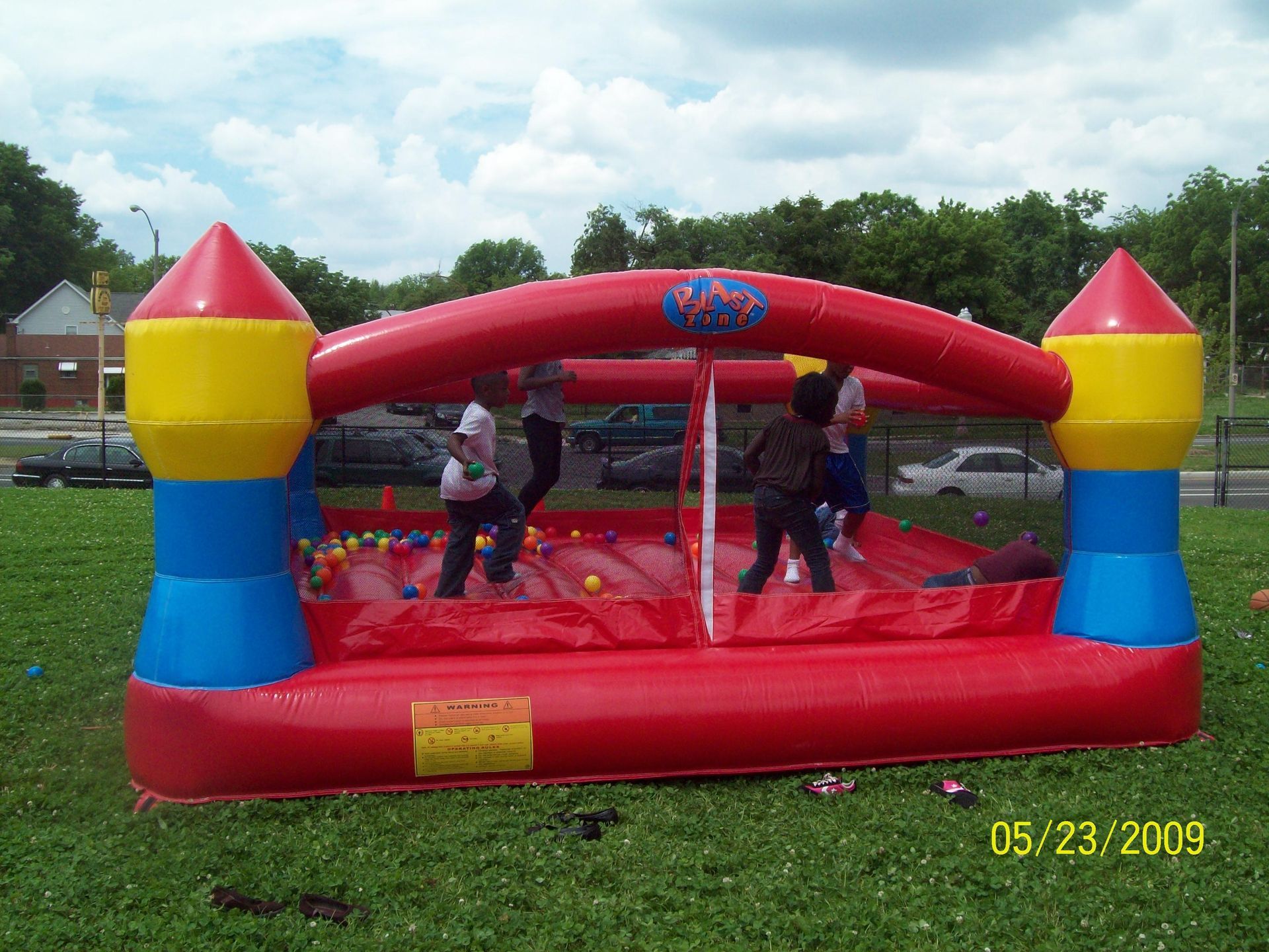 Red castle with balls bounce house rental