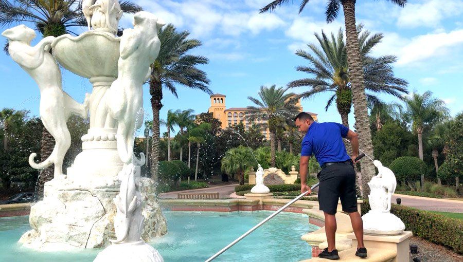 Picture of KSI Staff Cleaning Fountain