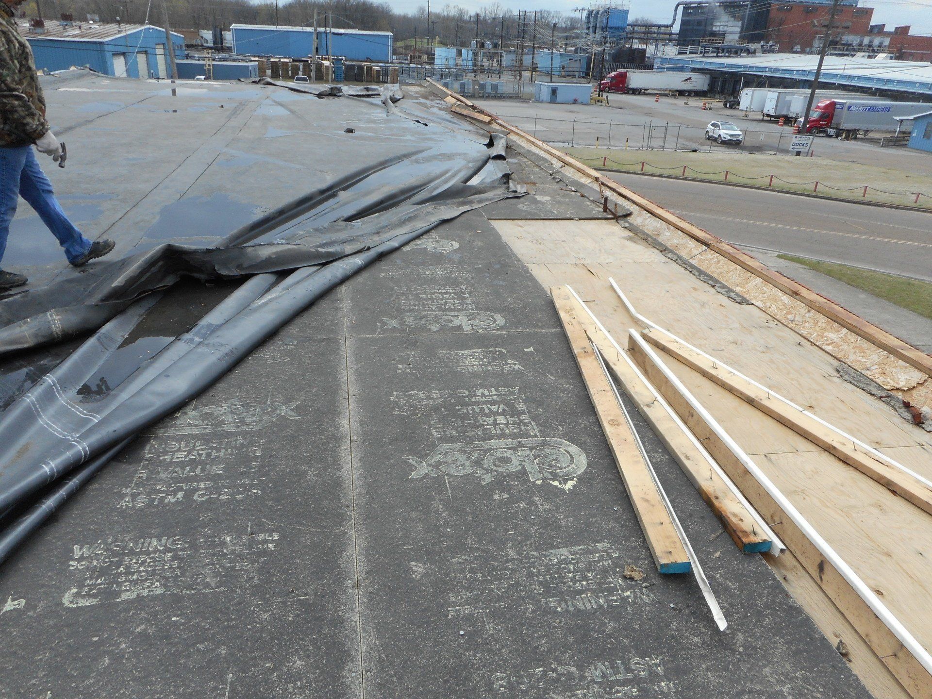 commercial roof with storm damage before repair