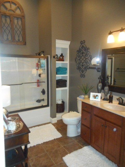 bathroom remodel with towel closet, hardwood flooring, and vanity