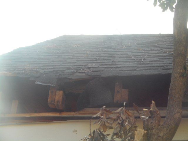 damaged roof before repair