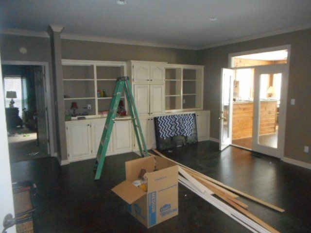 repair in progress after damage to walls and flooring