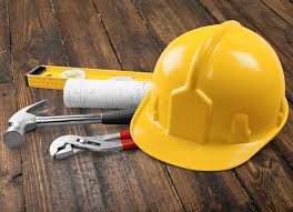 hard hat, pliers, and other tools