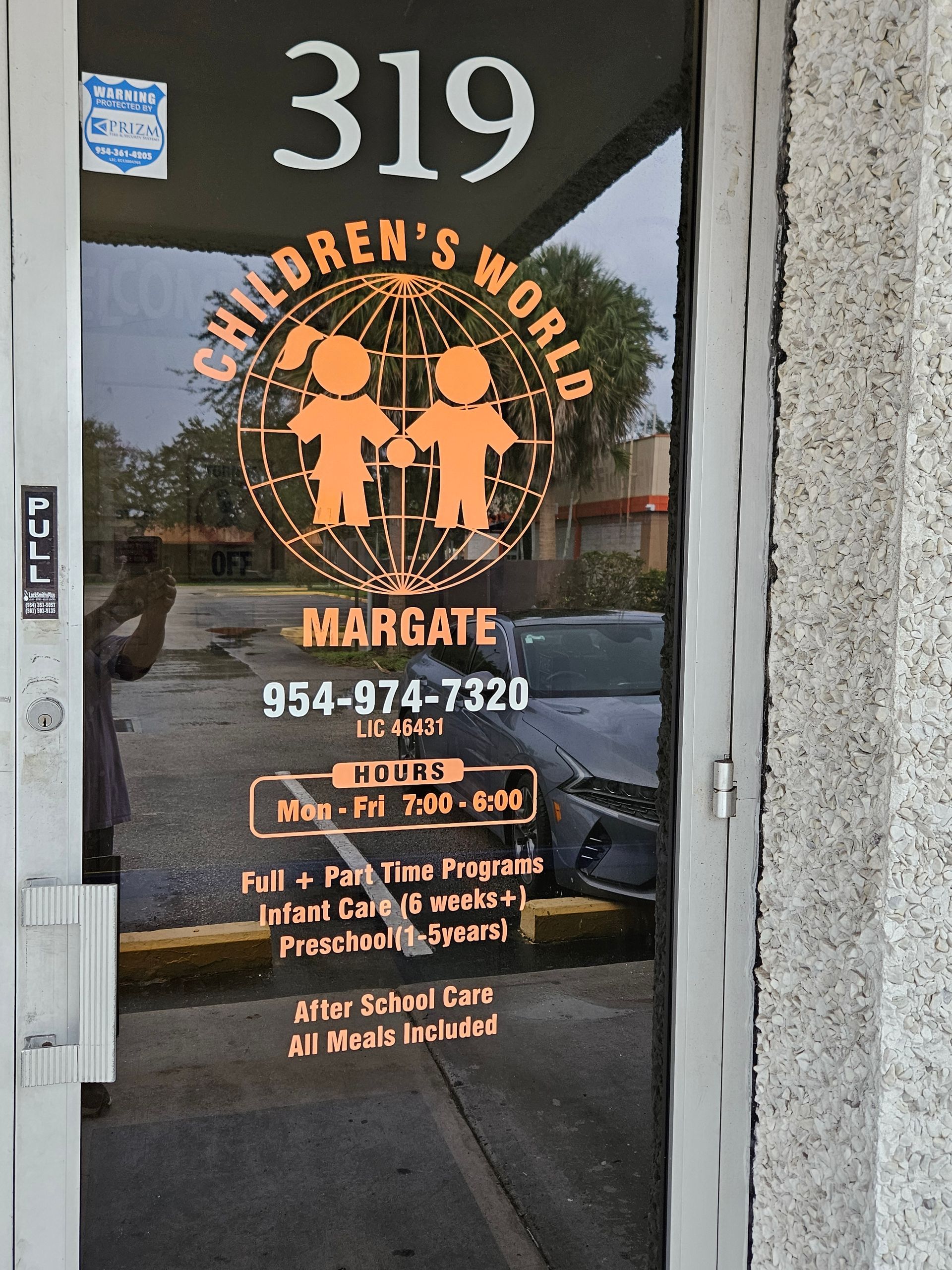 Door with Children's World logo, address 319, phone number, hours, and services in Margate.