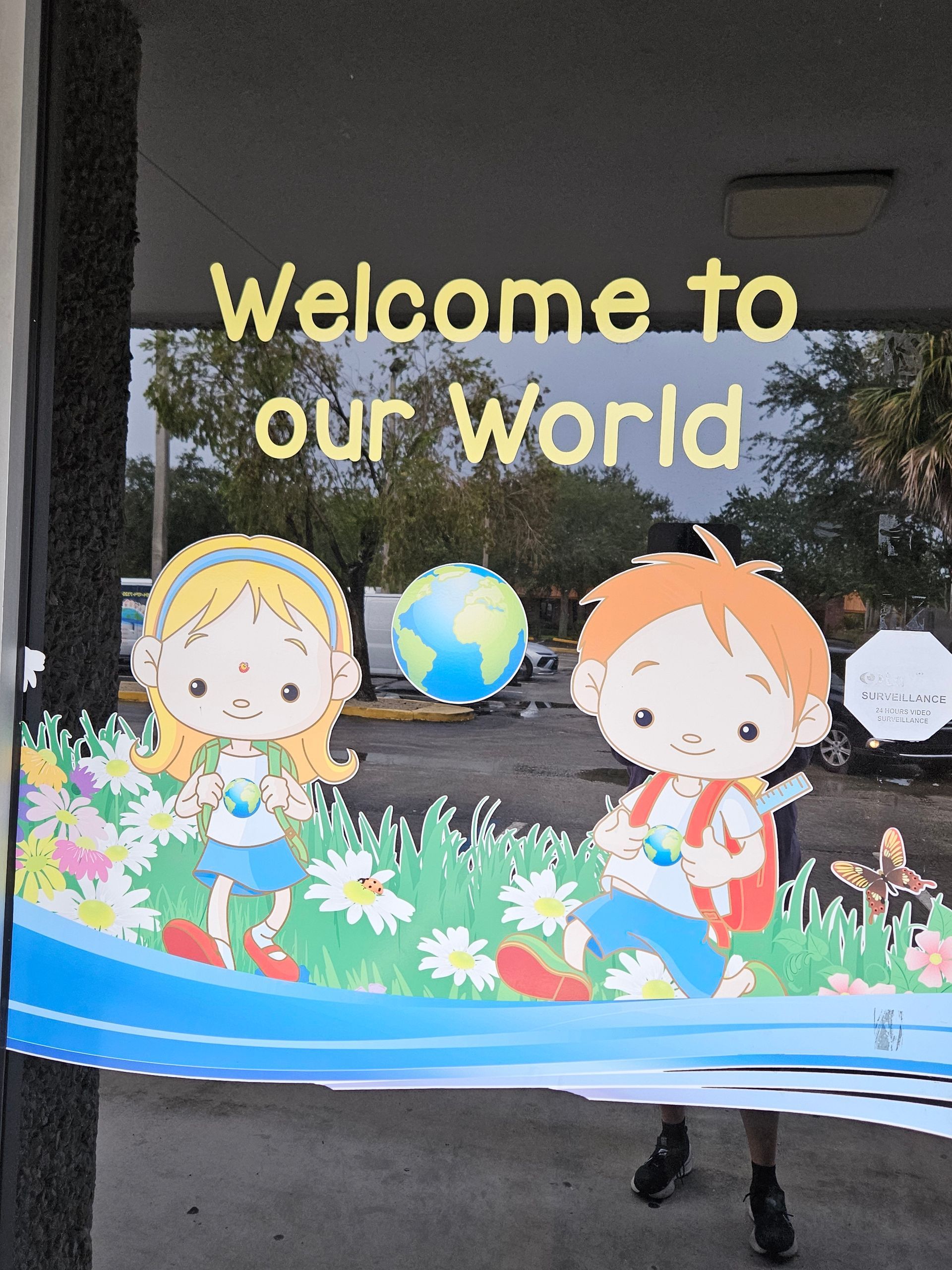 Cartoon children in a field, a globe, and 