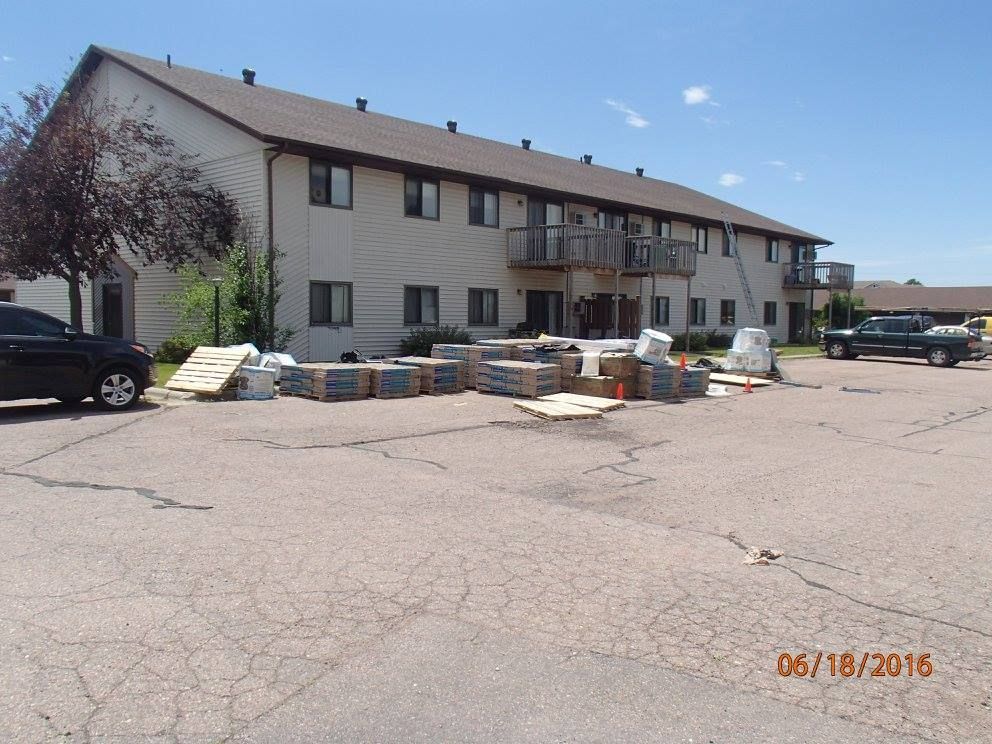 A building with a lot of boxes in front of it