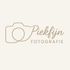 Een logo voor een fotograaf met een camera en het woord fotografie.