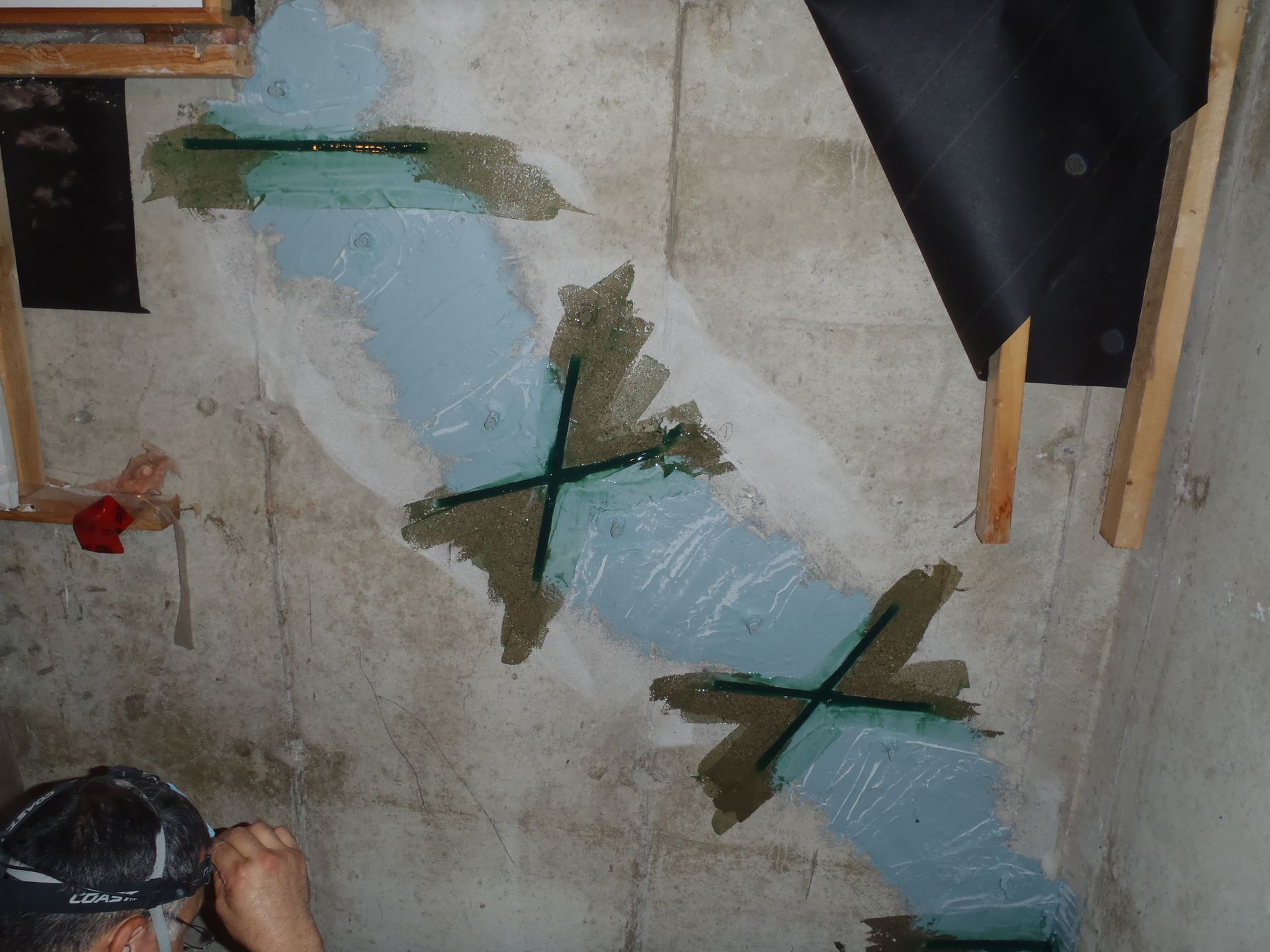 Interior basement wall being repaired with epoxy injection.