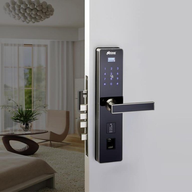 Black smart door lock on a white door; interior view of a living room with a modern design.
