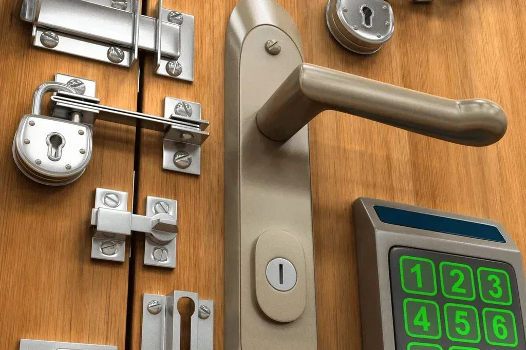 Close-up of a wooden door with multiple security measures: locks, latches, a handle, and a keypad.
