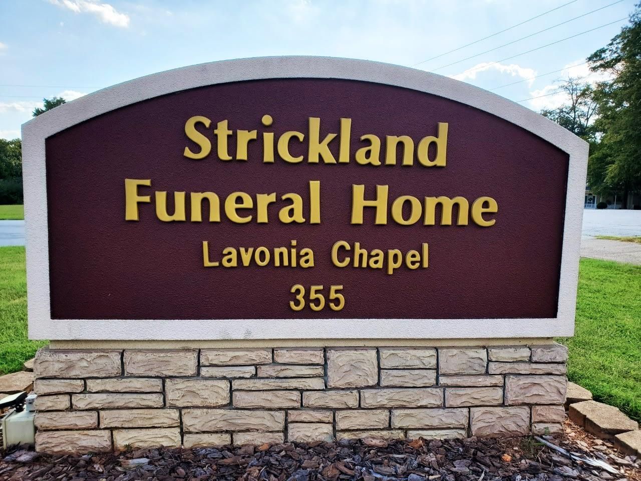 Sign for Strickland Funeral Home, Lavonia Chapel, with address 355.