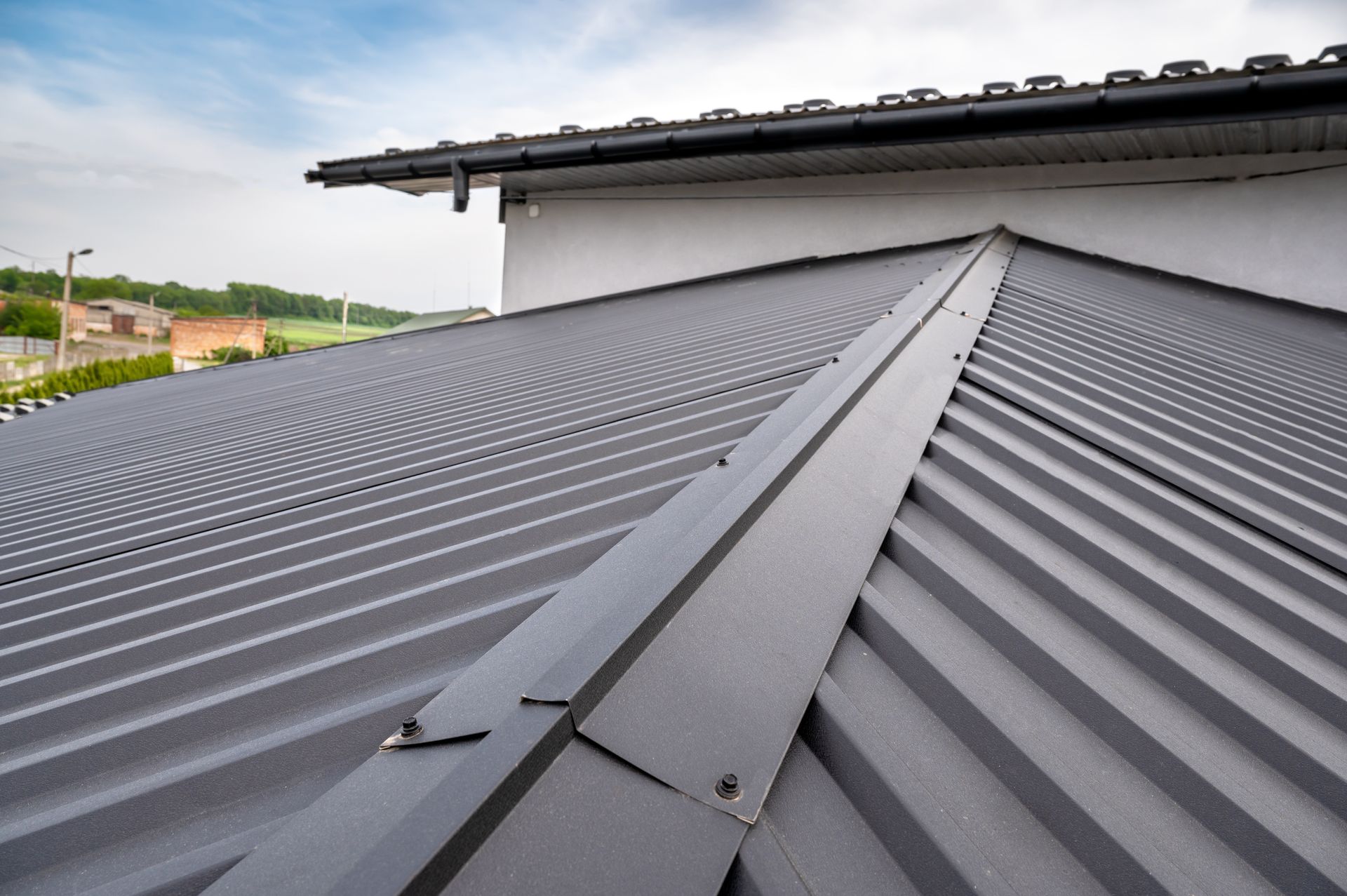 A close up of a metal roof on a house.