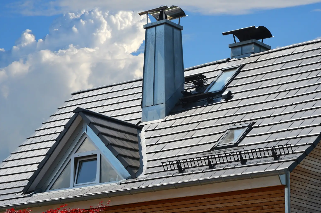 A house with a chimney on the roof and a window