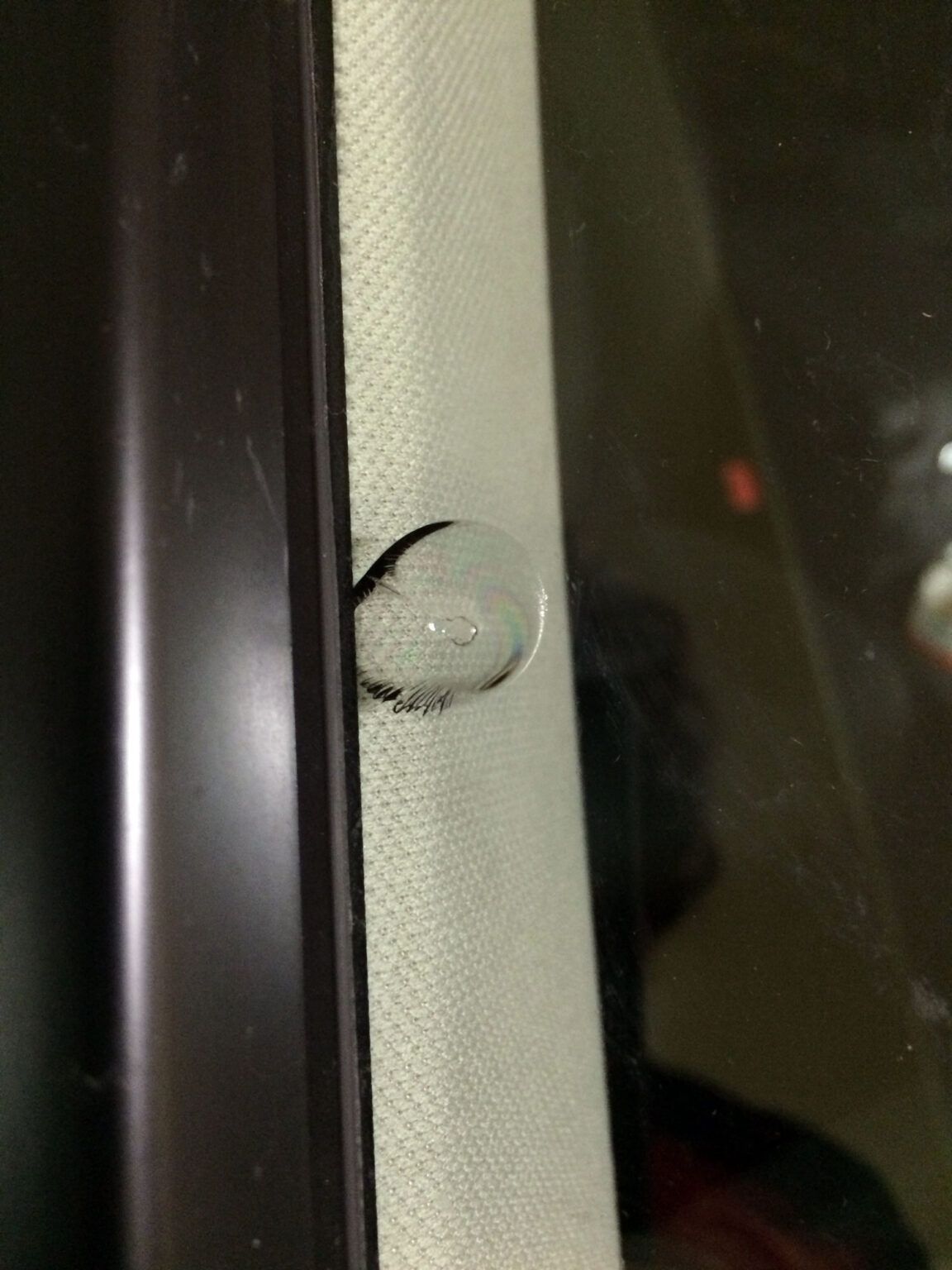 Before rock chip repair in Leander, TX