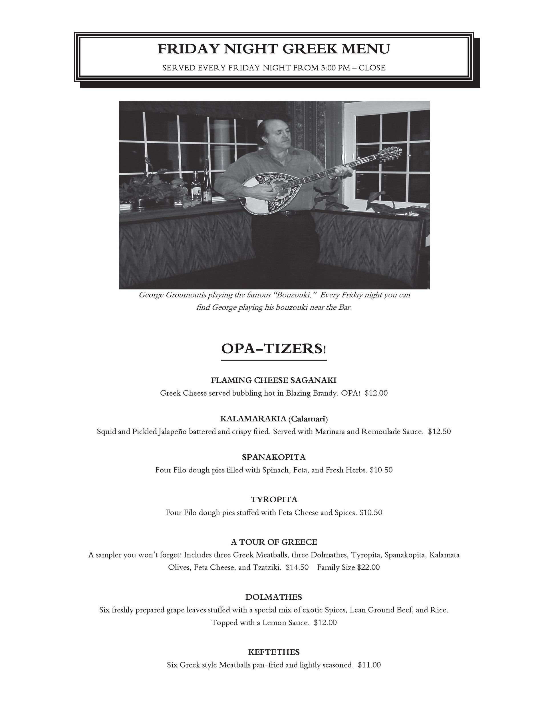 A black and white photo of a man sitting at a table.