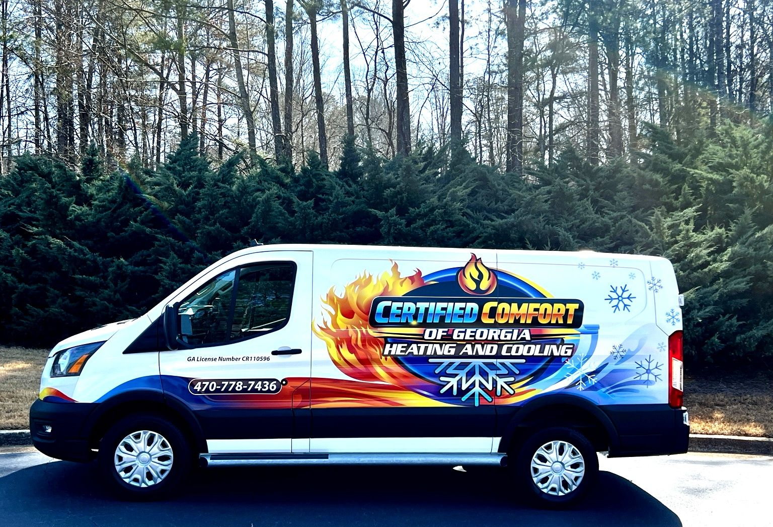 Certified Comfort of Georgia van with Certified Comfort of GA heating and cooling logo in front of trees in a neighborhood