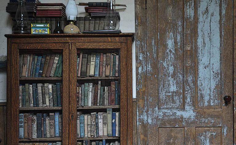 a bookcase with a glass door filled with books and a lamp on top. Starksboro Quaker Meeting House, VT. 