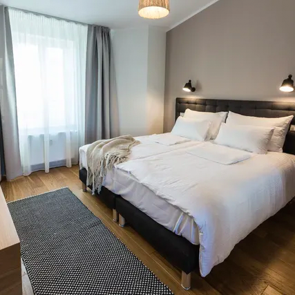 There is a large bed in the middle of the room.