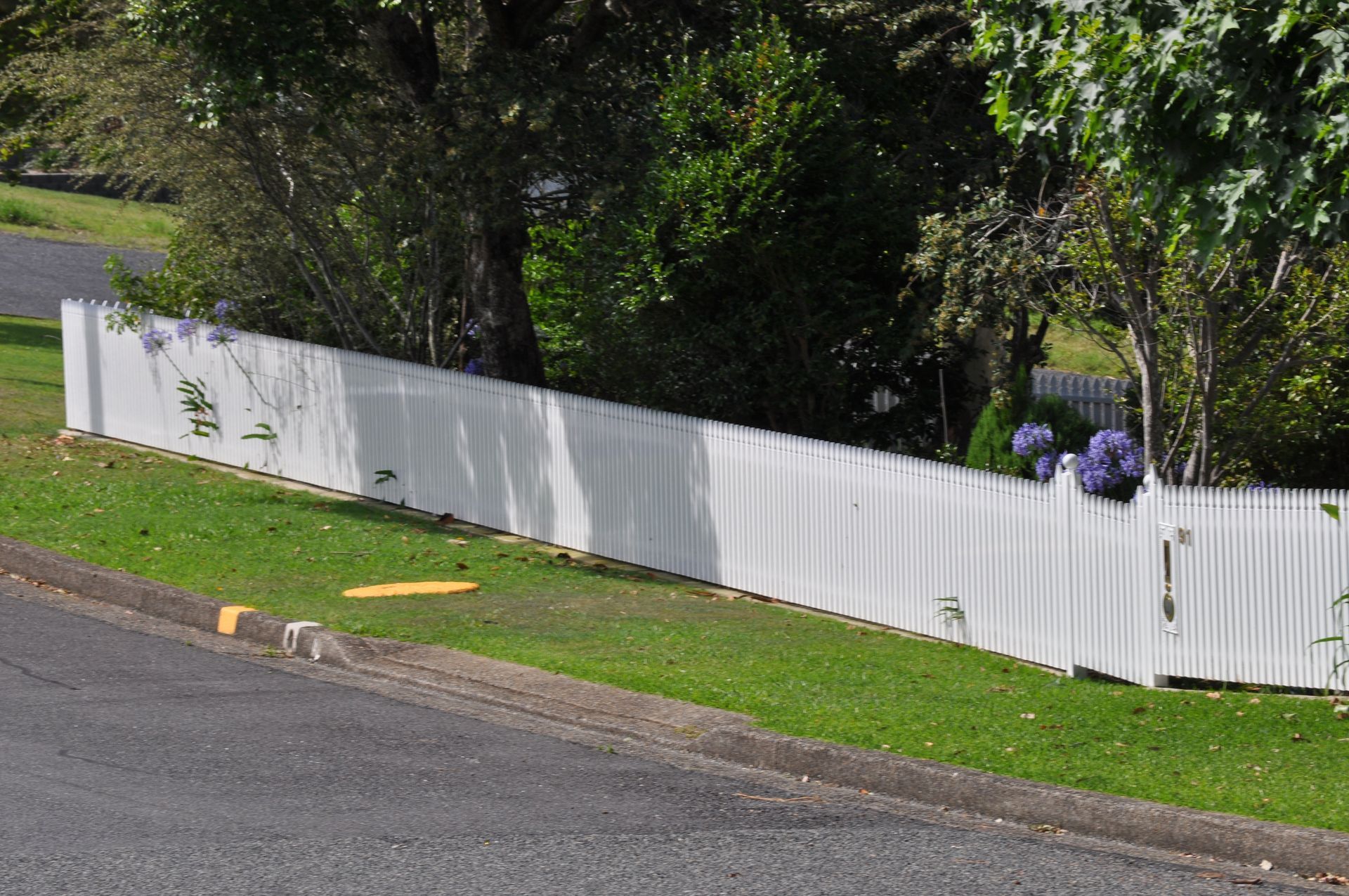 A white fence along the side of a road — Fabricator In Coffs Harbour, NSW