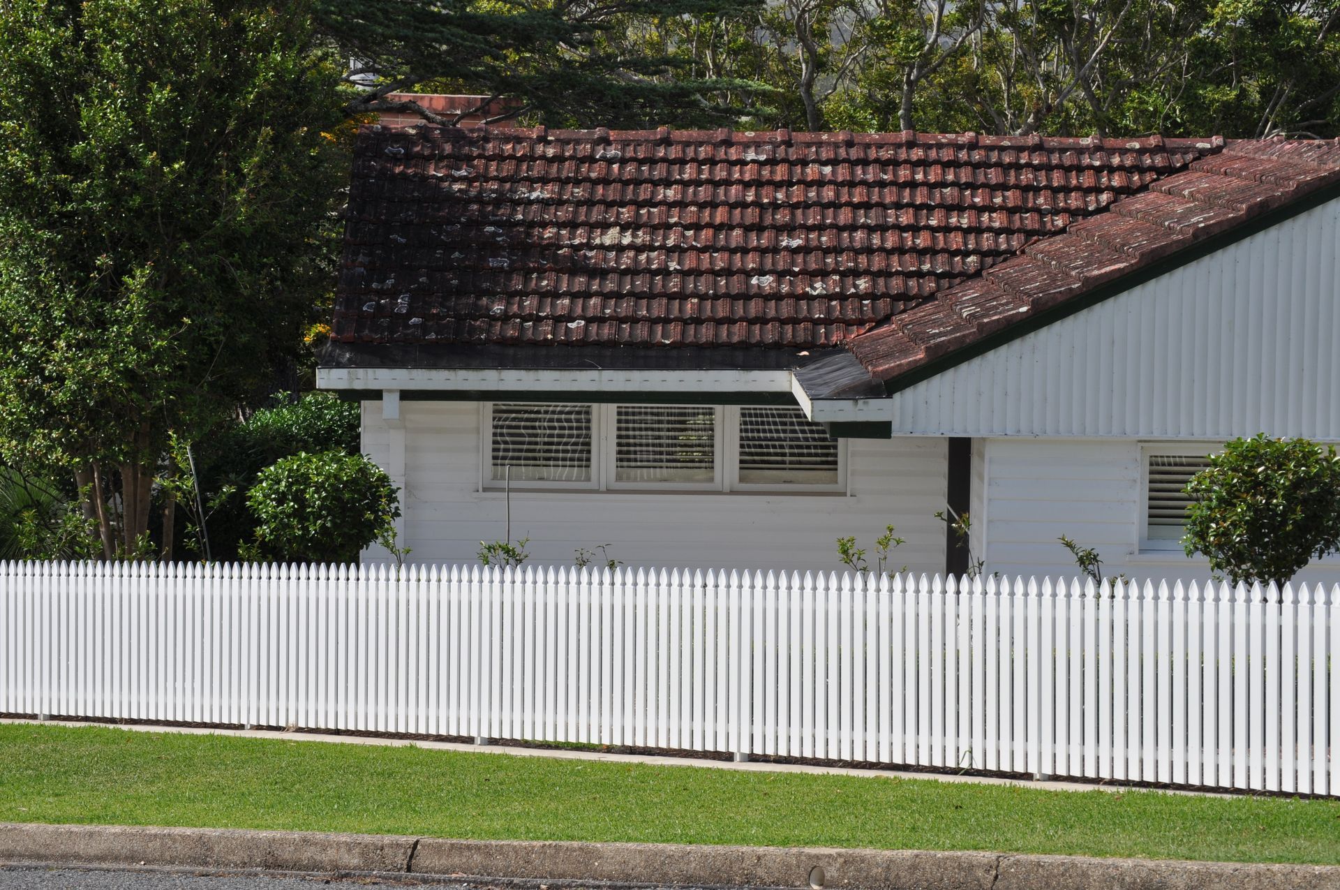 A white house with a white picket fence around it — Fabricator In Coffs Harbour, NSW