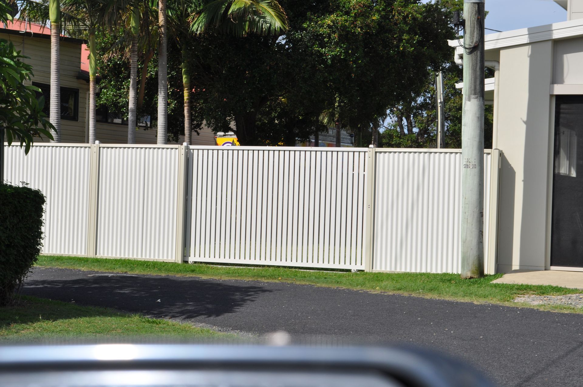 A white fence with a black door in the background — Fabricator In Coffs Harbour, NSW