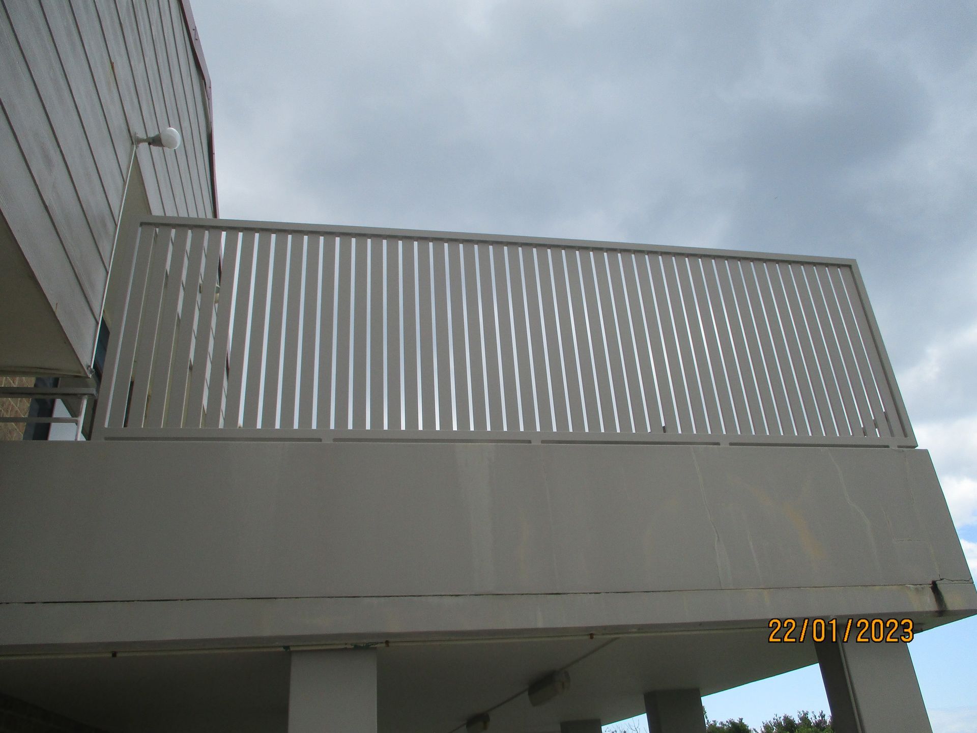 A balcony with a fence and a cloudy sky in the background — Fabricator In Coffs Harbour, NSW