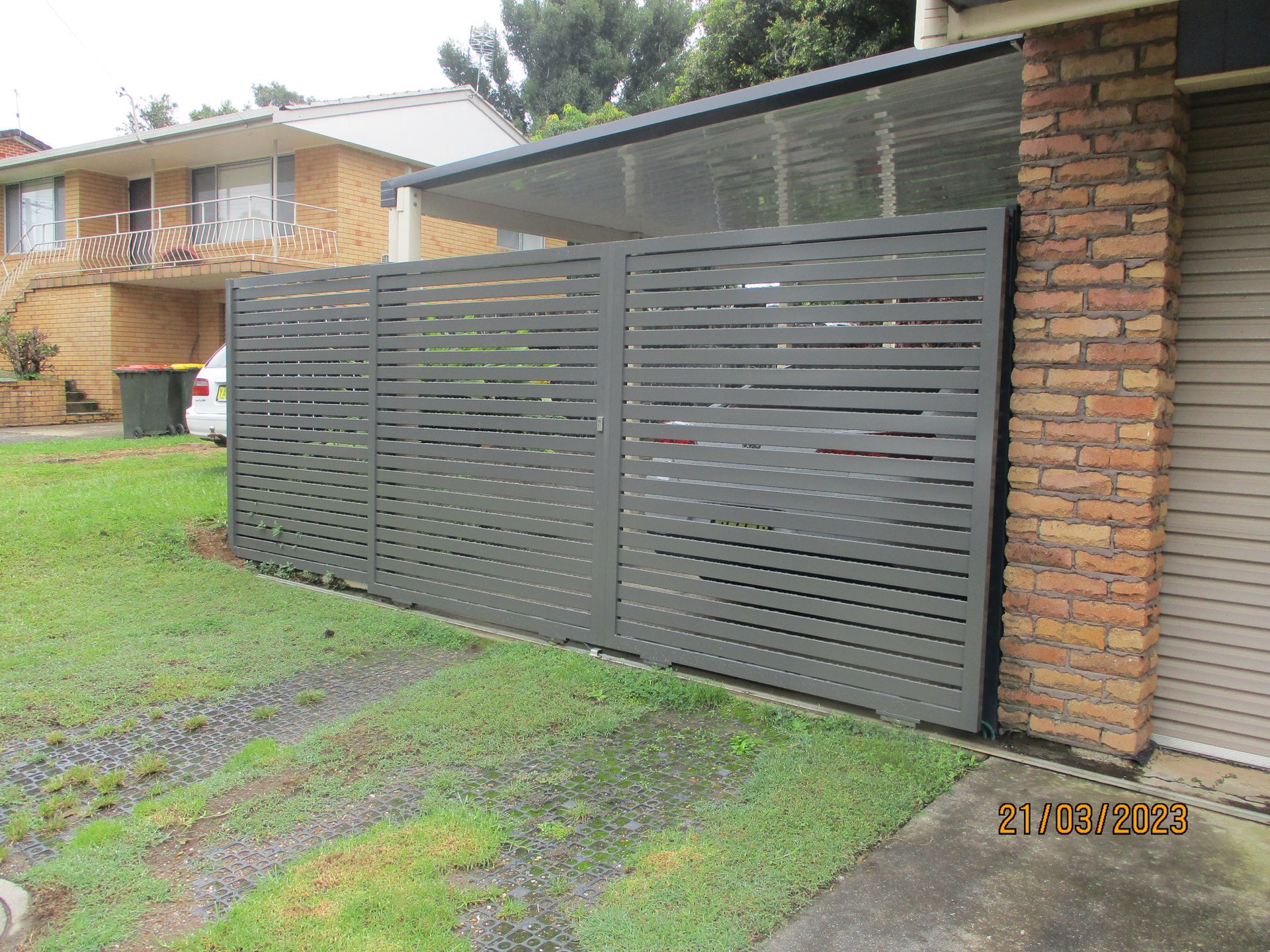 A house with a fence and a car parked in front of it — Fabricator In Coffs Harbour, NSW