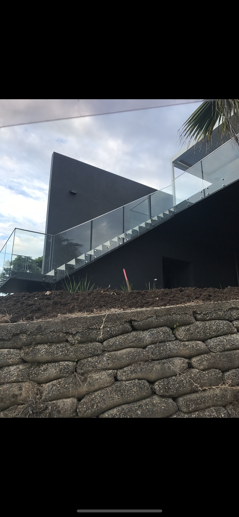 A building with a glass railing on the side of it — Fabricator In Coffs Harbour, NSW