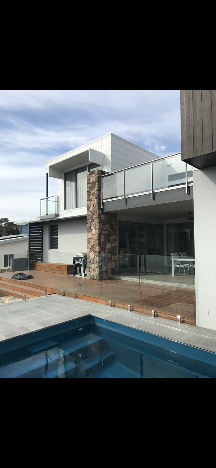 A large house with a swimming pool in front of it — Fabricator In Coffs Harbour, NSW