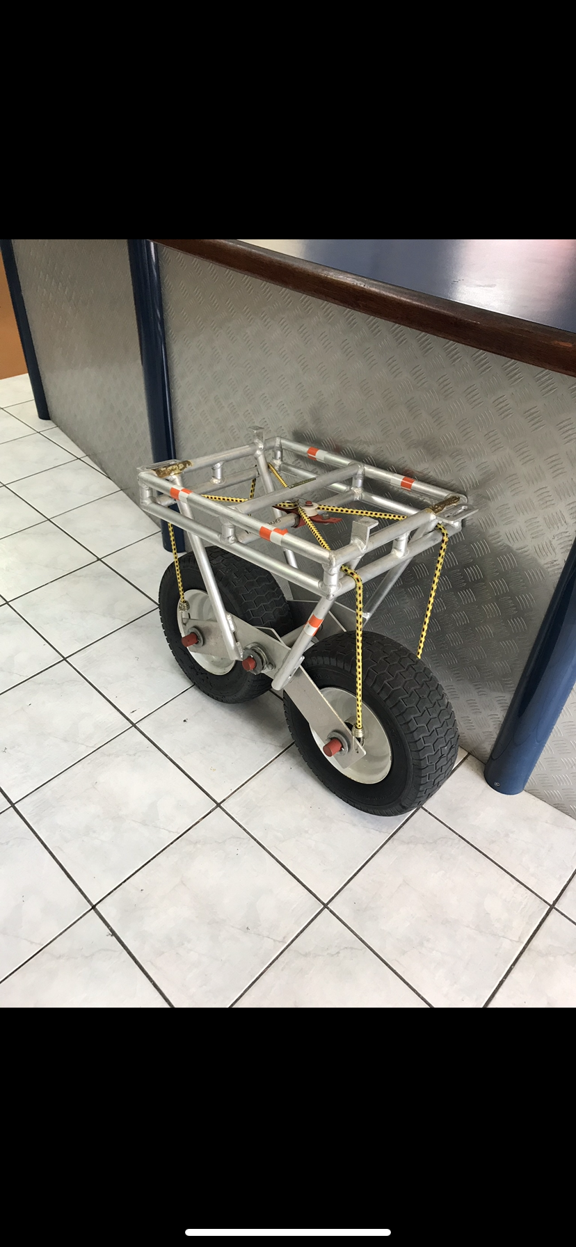 A small cart is sitting on a tiled floor next to a counter — Fabricator In Coffs Harbour, NSW