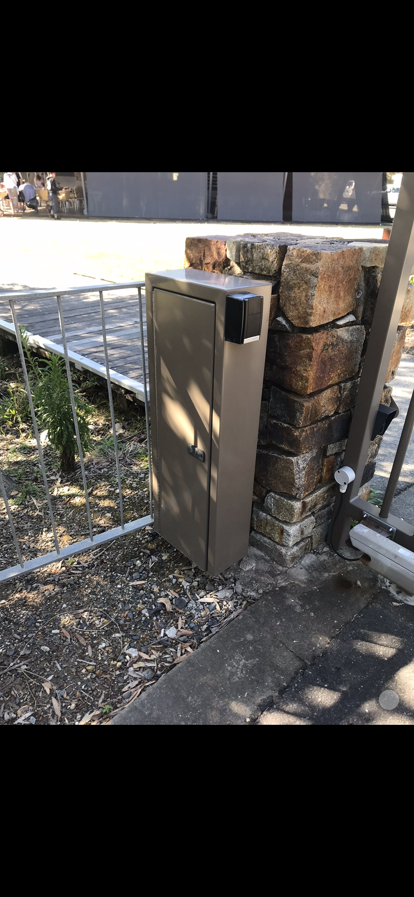 A trash can is sitting next to a brick wall — Fabricator In Coffs Harbour, NSW