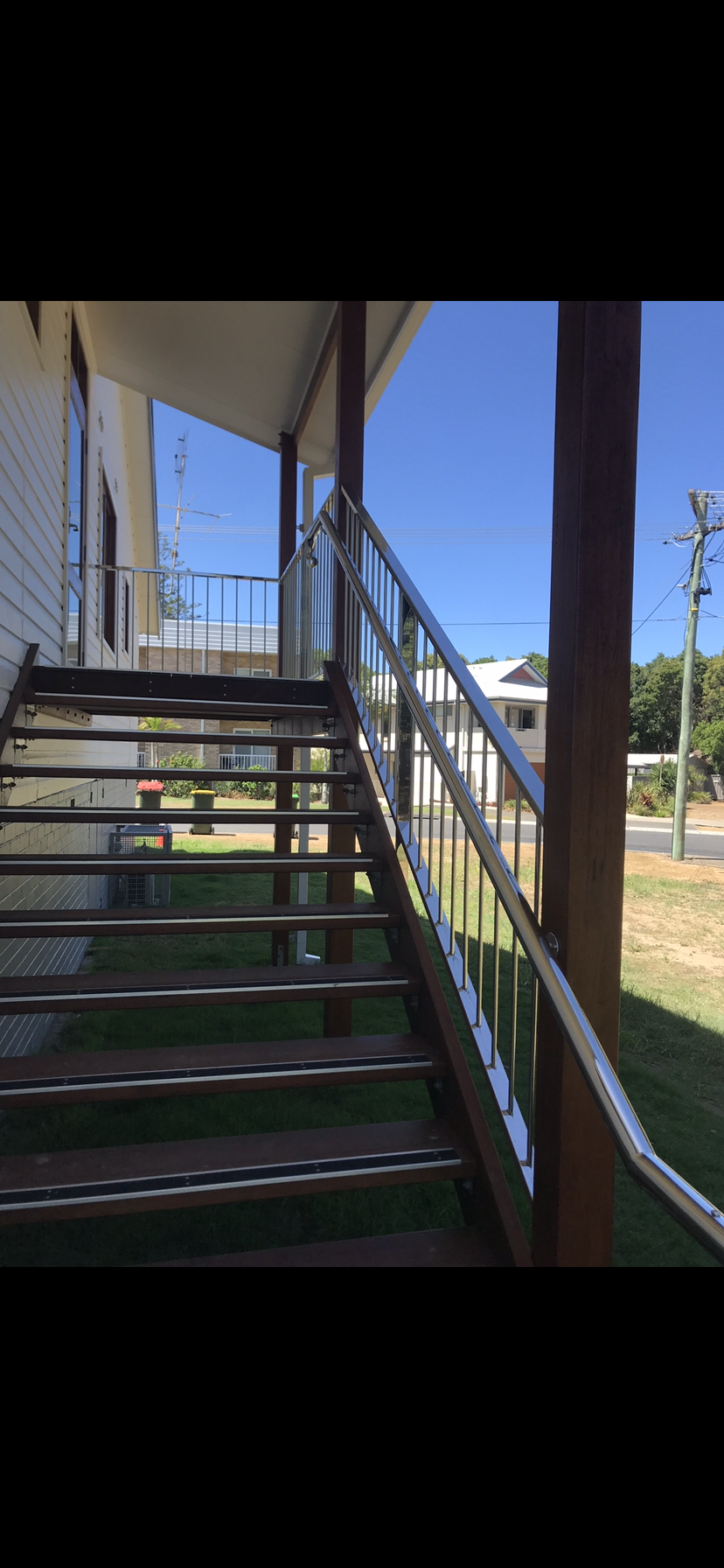 A set of stairs leading up to a porch of a house — Fabricator In Coffs Harbour, NSW