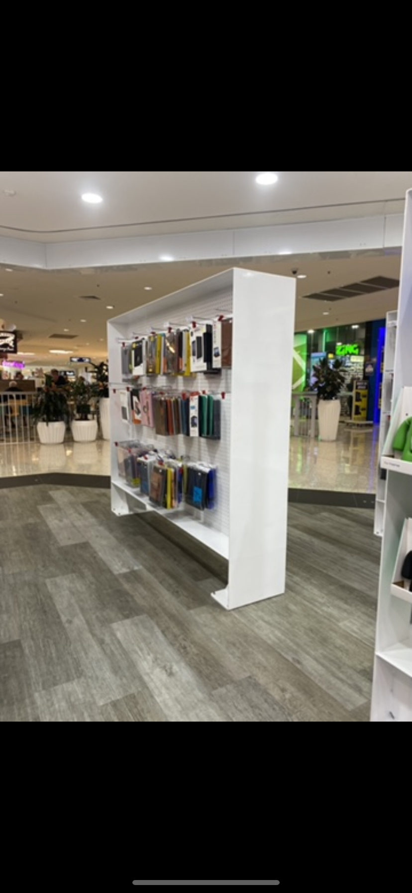 A store with a lot of cell phone cases on display — Fabricator In Coffs Harbour, NSW