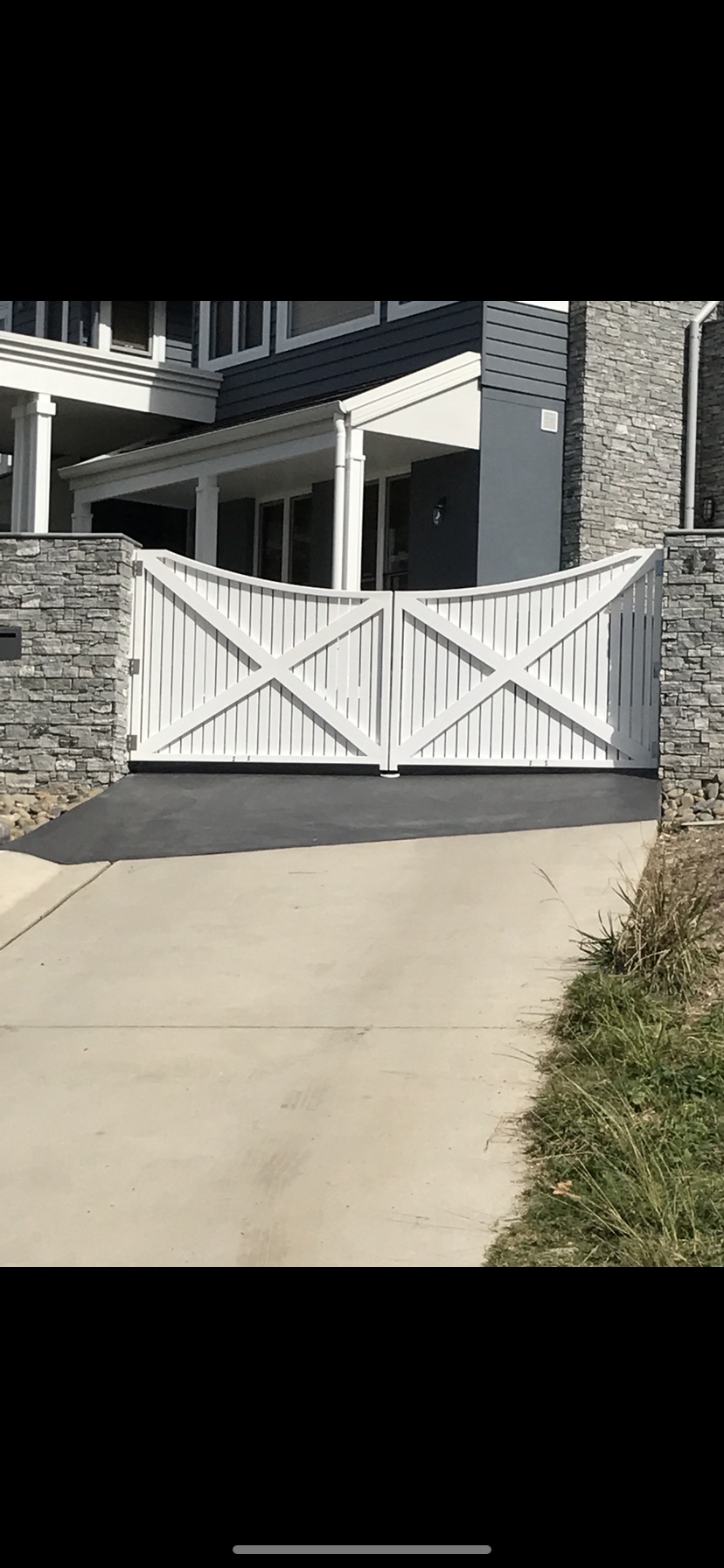 Black Automatic Gate Is Surrounding A House — Fabricator In Coffs Harbour, NSW