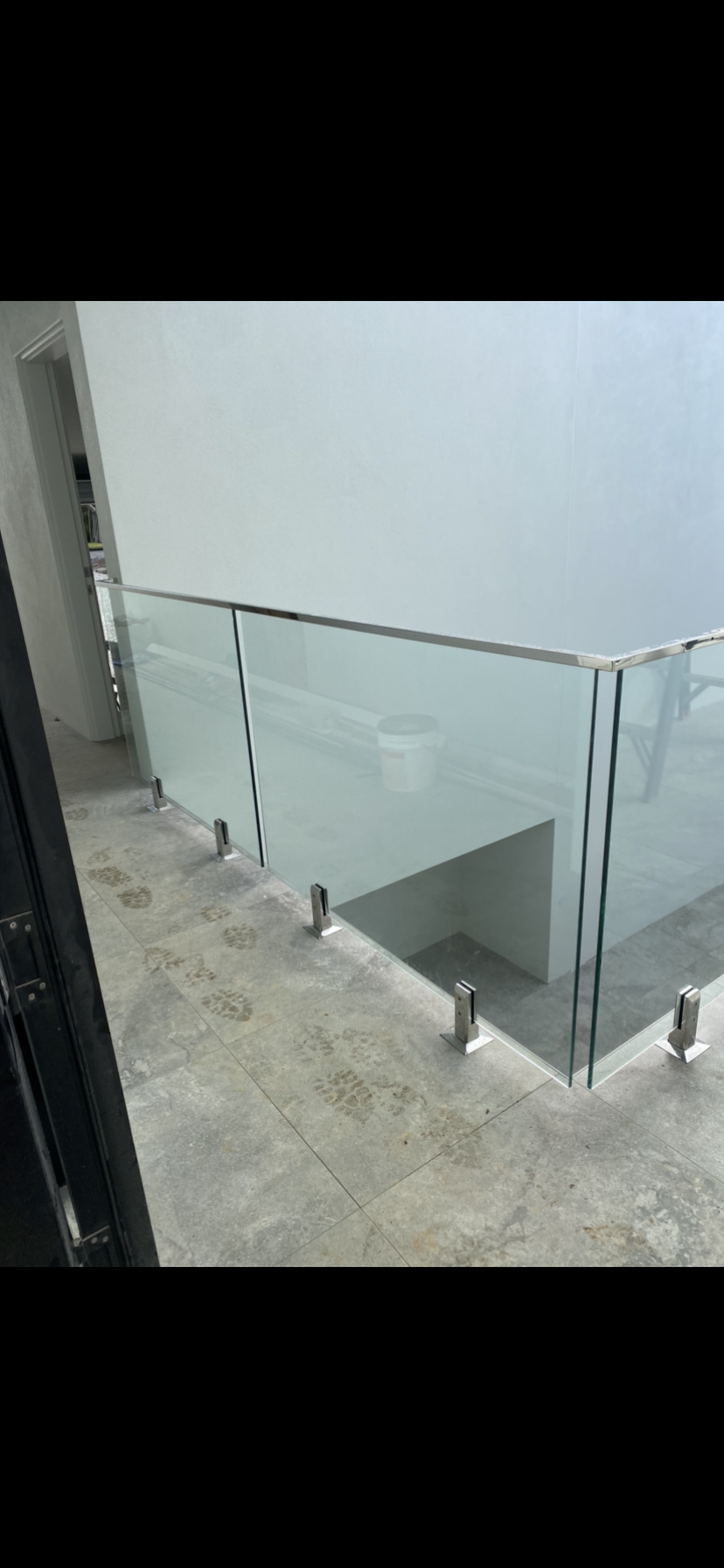 A staircase with a glass railing and a stainless steel railing — Fabricator In Coffs Harbour, NSW