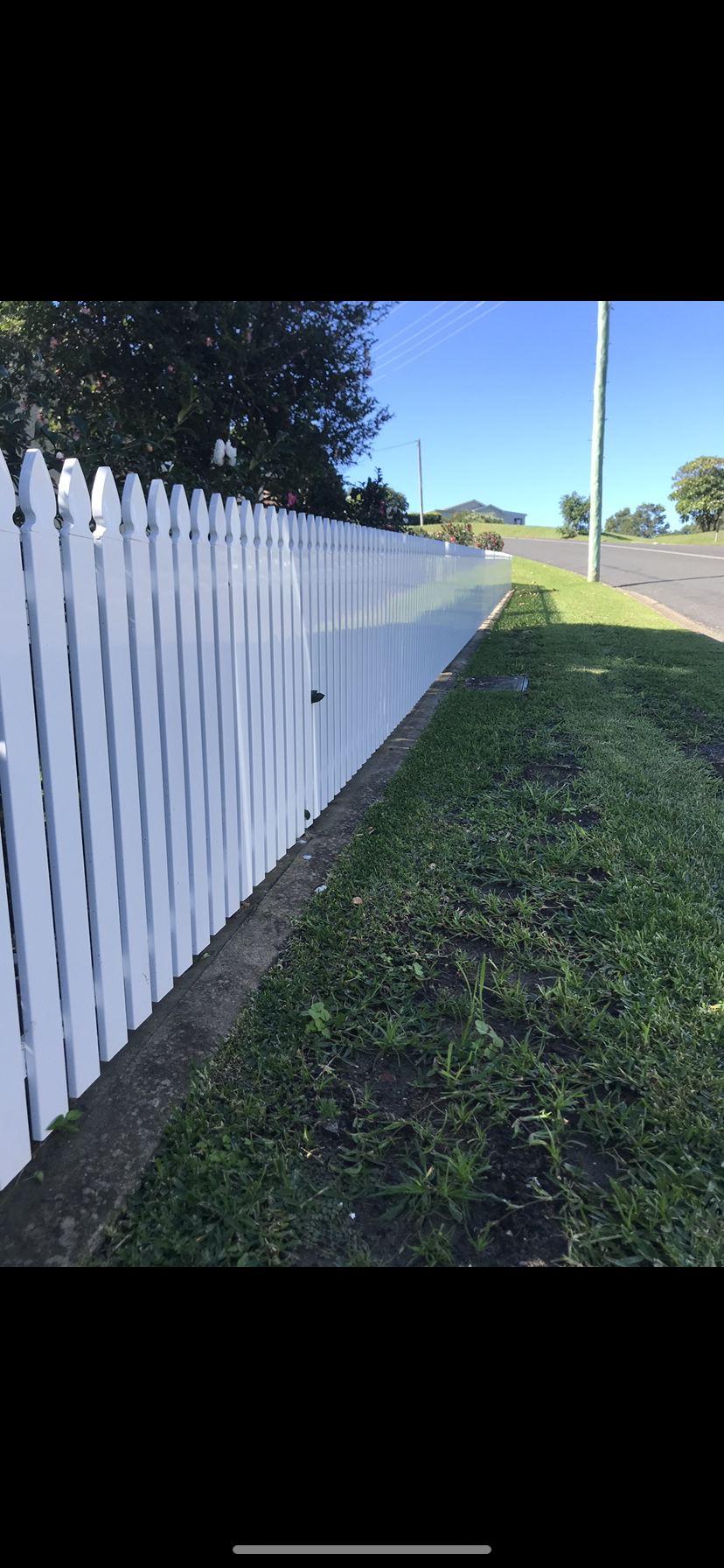 A white picket fence along the side of a road — Fabricator In Coffs Harbour, NSW